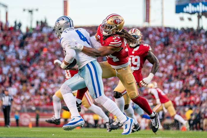 San Francisco 49ers linebacker Fred Warner sacks Dallas Cowboys quarterback Dak Prescott.